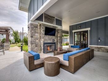 Outdoor fireplace with lounge area